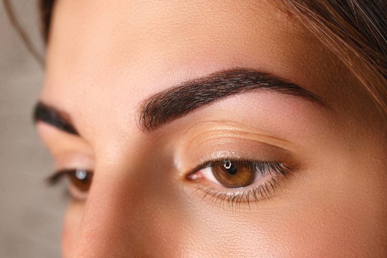 young-woman-with-beautiful-eyebrows-after-correction-closeup